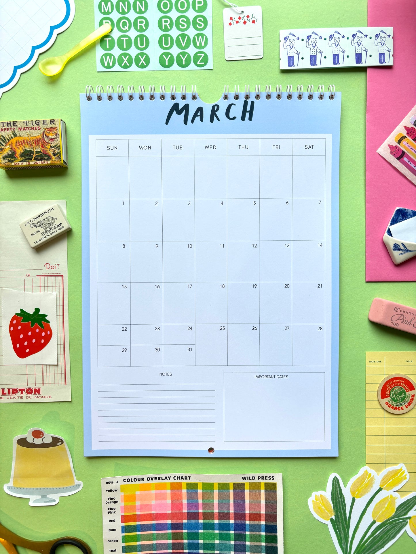 Calendar for March on a colorful background with stationery items