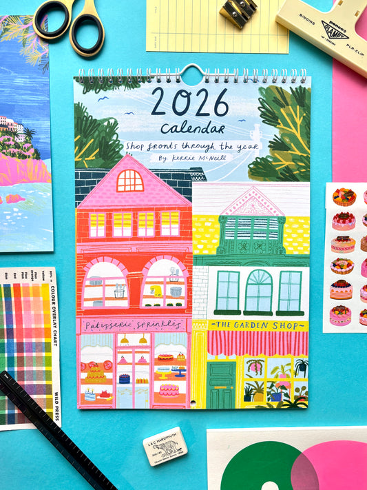 2026 calendar with colorful illustrations of buildings on a blue background